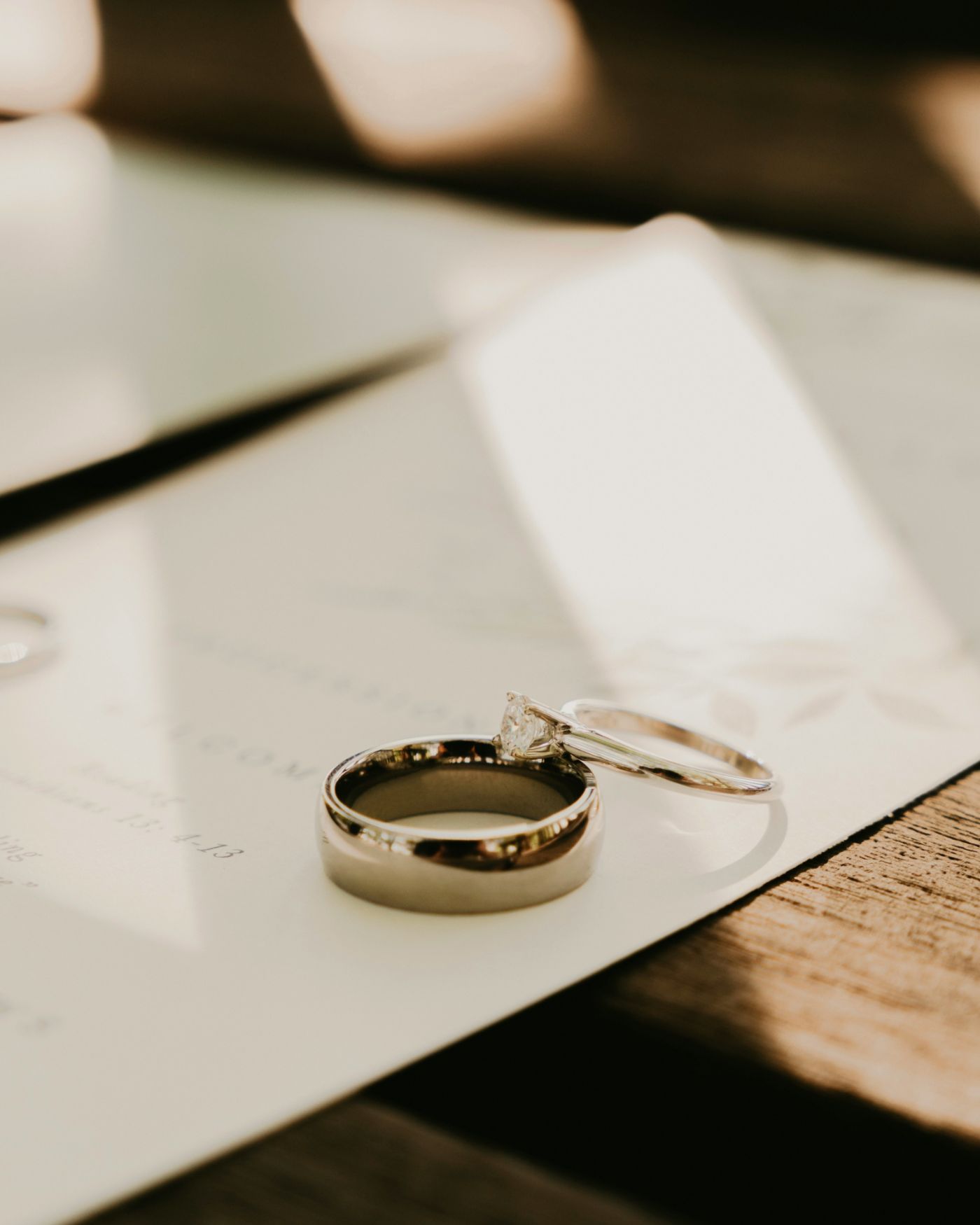 A house key and a deed beside wedding rings, representing marital property in South Carolina.