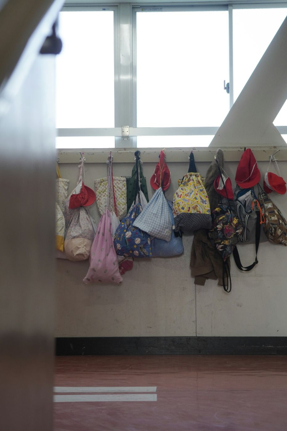 Empty backpack by a front door illustrating how to enforce a visitation order in South Carolina after summer