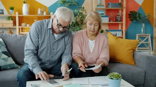 Man and woman looking at finances together