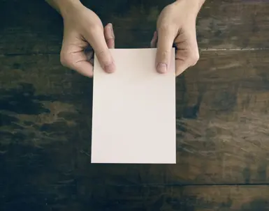 Someone holding piece of paper