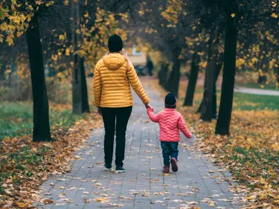 Mother holding child's hand