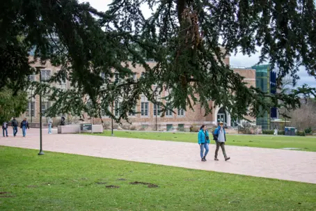 Two people walking a college campus