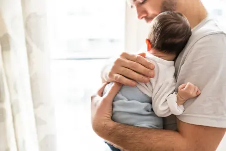Father holding baby son