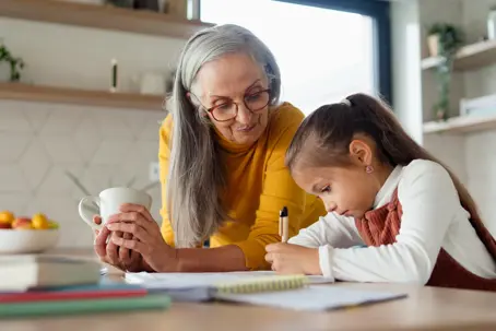 Grandma helping with grandchild's homework