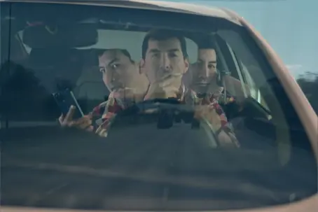 someone on their phone while driving.