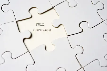 a puzzle with a missing piece that says full coverage.