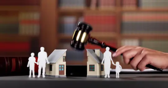 Gavel splitting house in a divorce